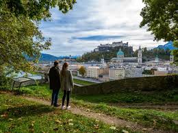 lovely couple admiring the view in salzburg